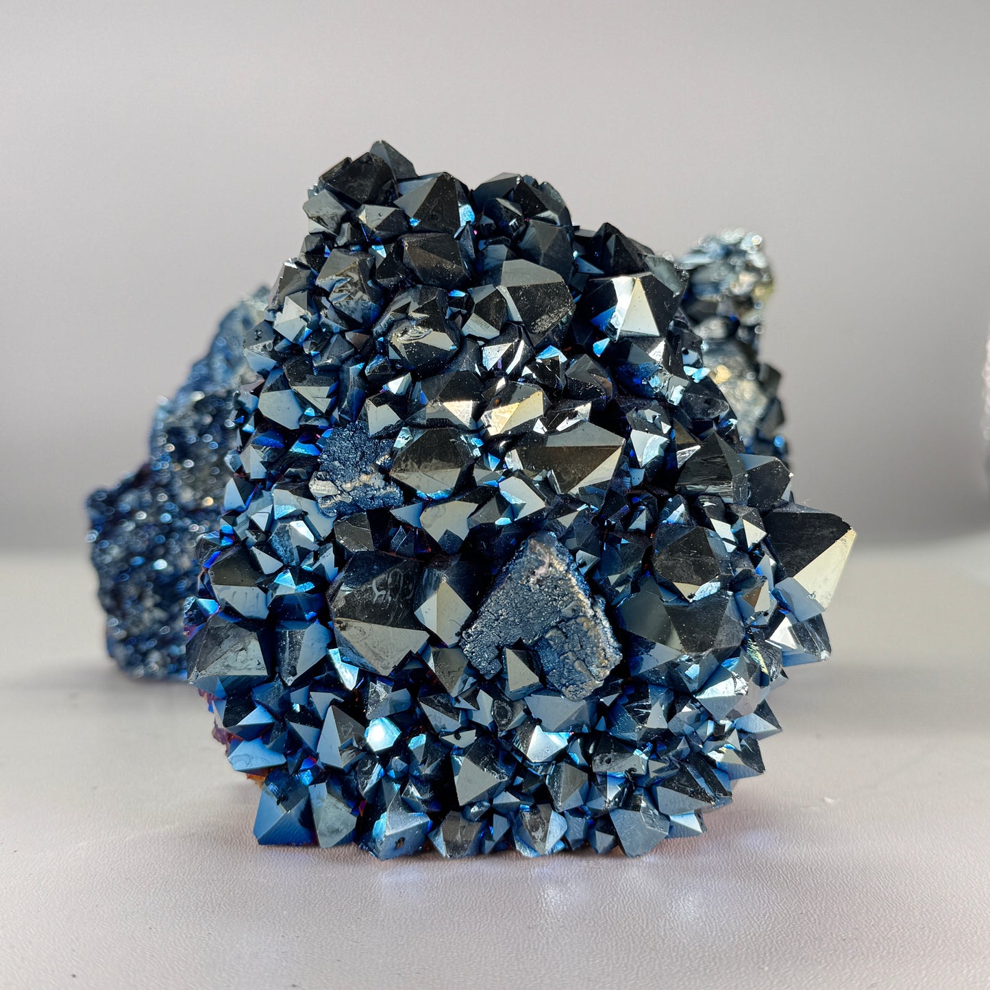 Titanium blue cluster cut base