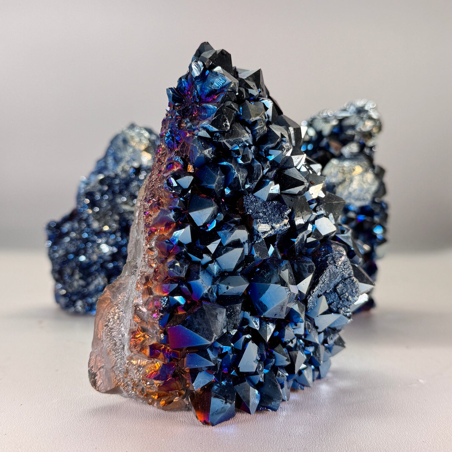 Titanium blue cluster cut base